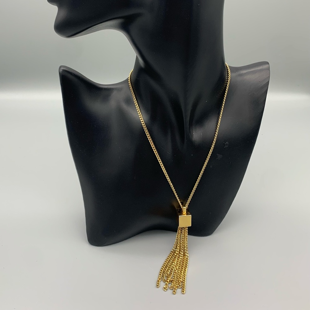 Vintage Monet gold tone necklace with box fringe pendant. Good condition.